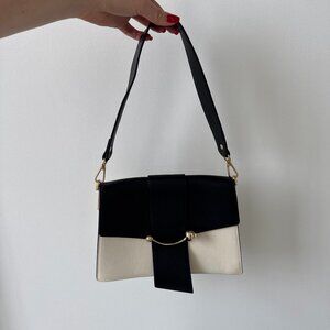 STRATHBERRY | Black and Cream Crescent Shoulder Bag
